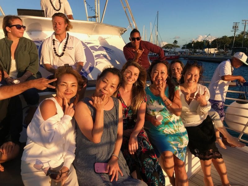 Group of people taking photo close to tour boat