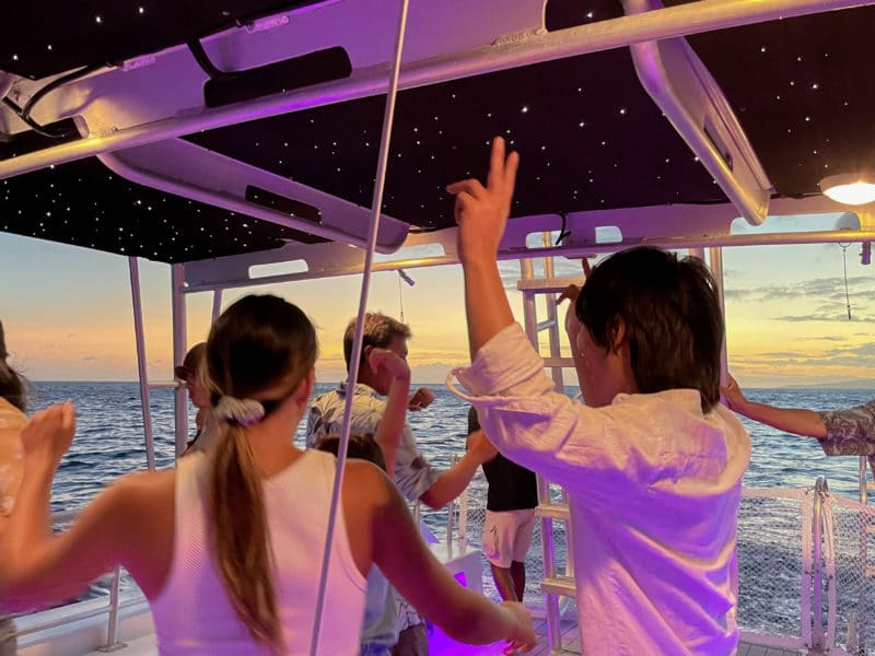 Guests dance on BYOB Waikiki Booze Cruise